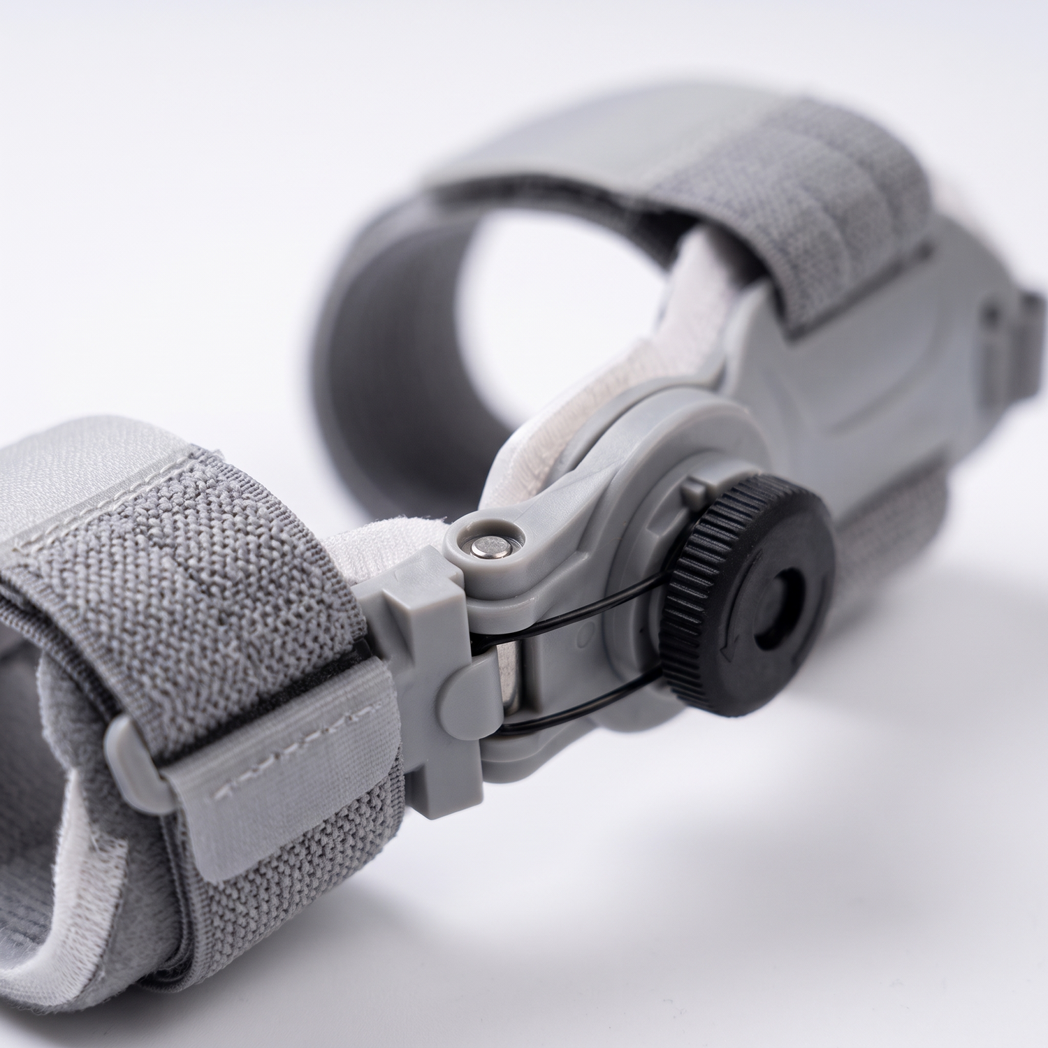 Close-up of the adjustable hinge and strap on the bunion corrector