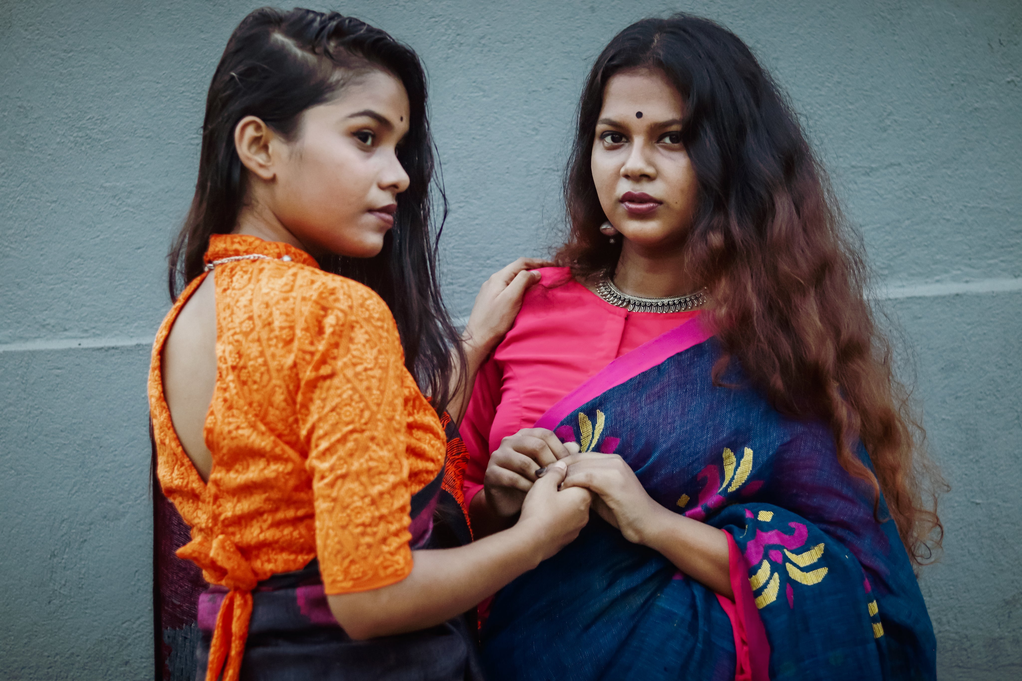 files/two-woman-hold-hands-outside-while-facing-each-other.jpg